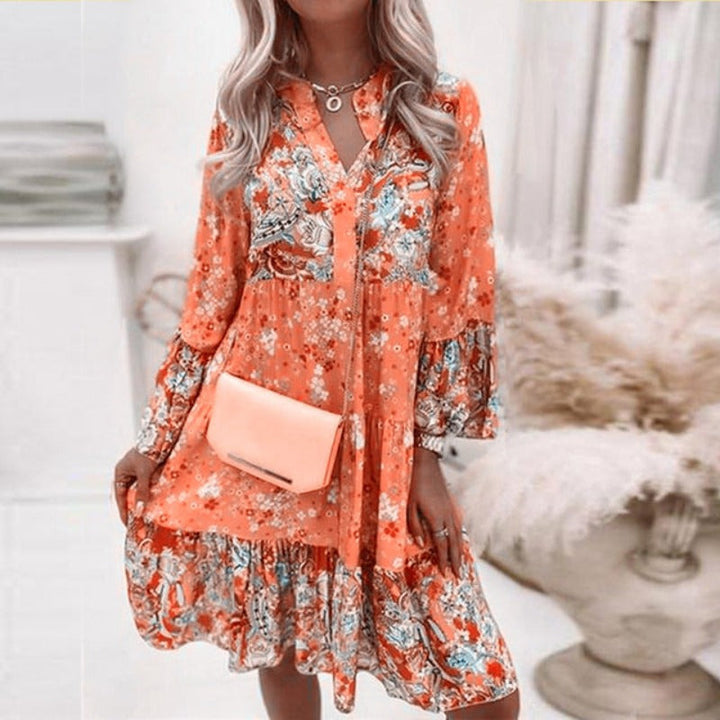 Elegantes Sommerkleid mit Blumenmuster in Orange