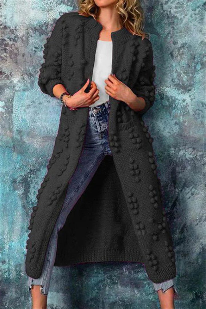 Lange Damen Strickjacke im Norweger-Stil mit Pompons in Schwarz