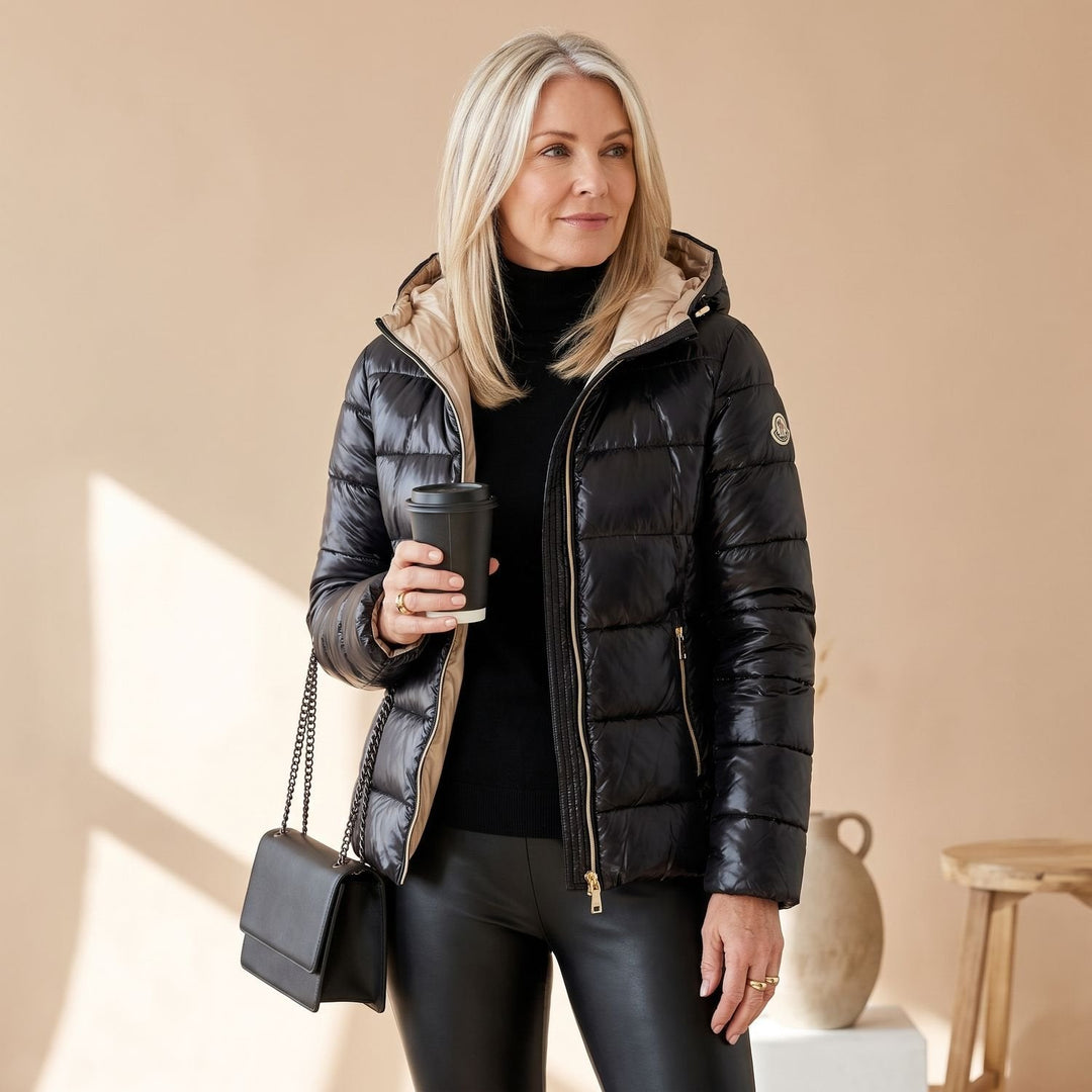 Mittellange Damen Winterjacke mit gesteppter Kapuze in Schwarz